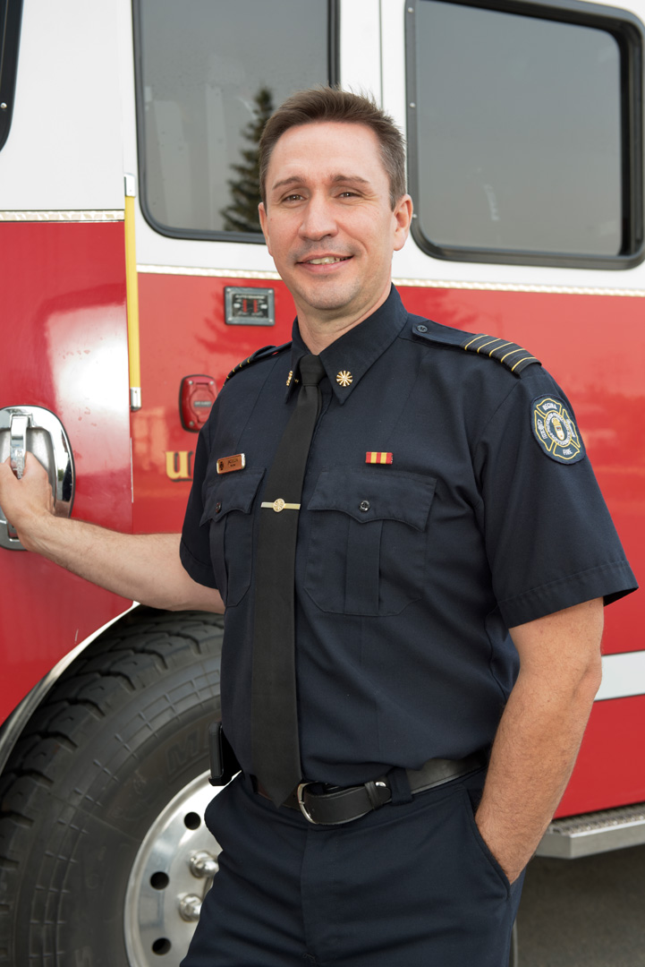 Layne Jackson, chief of Regina Fire and Protective Services, standing in front of fire truck
