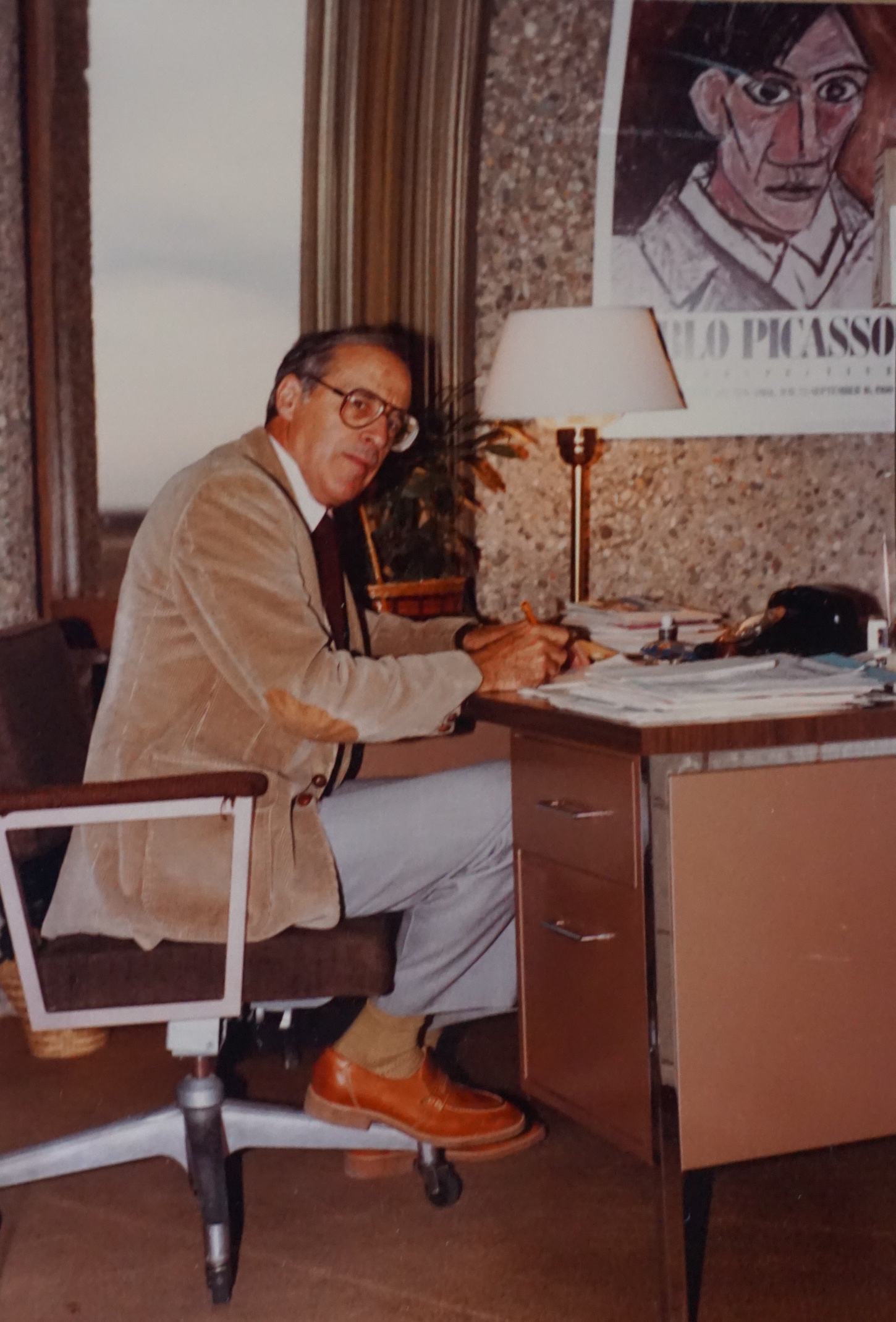 Individual at desk in the 1970s