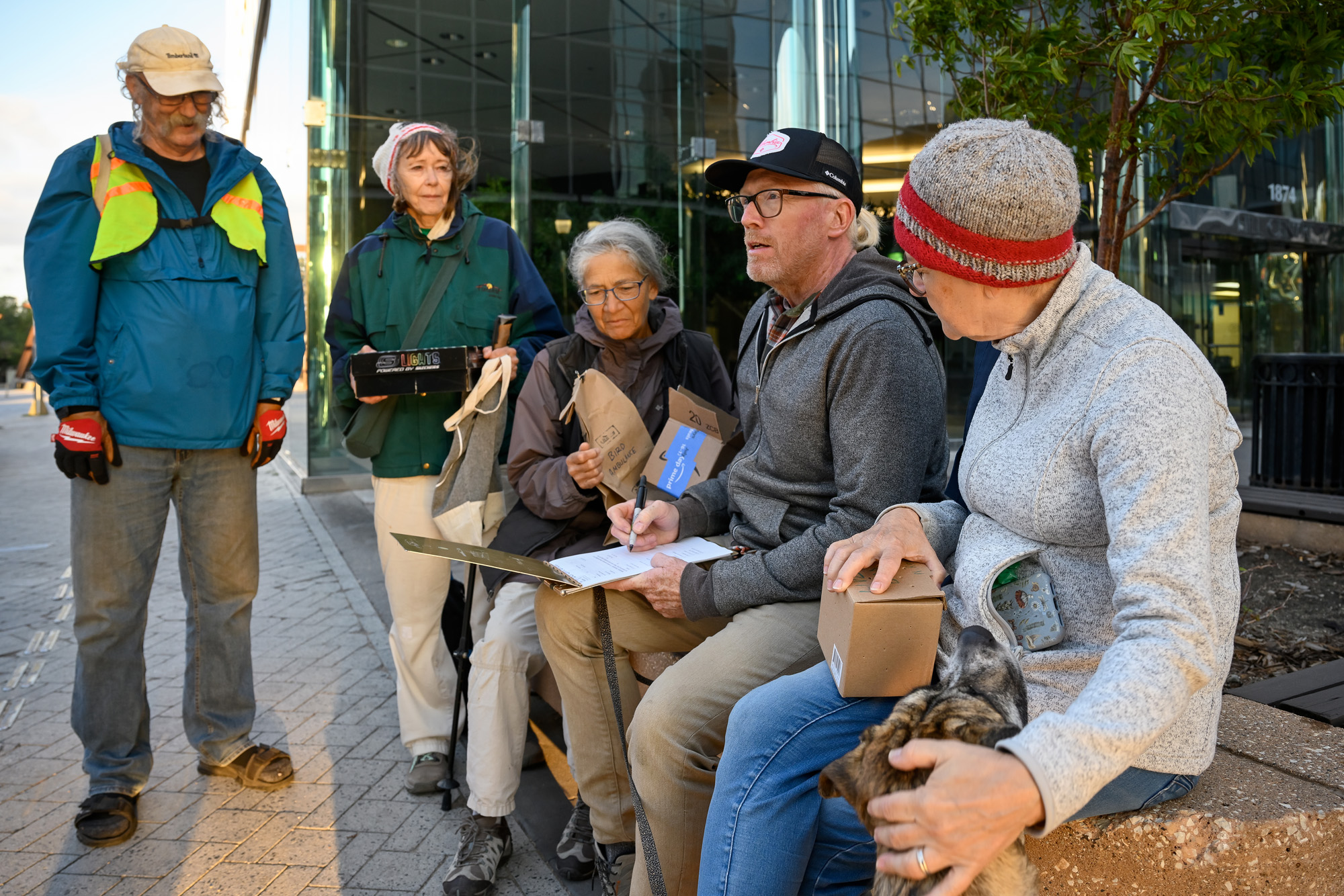 Members of Nature Regina's Bird Safe Initiative team confer with Jeff Gamble while on patrol. 